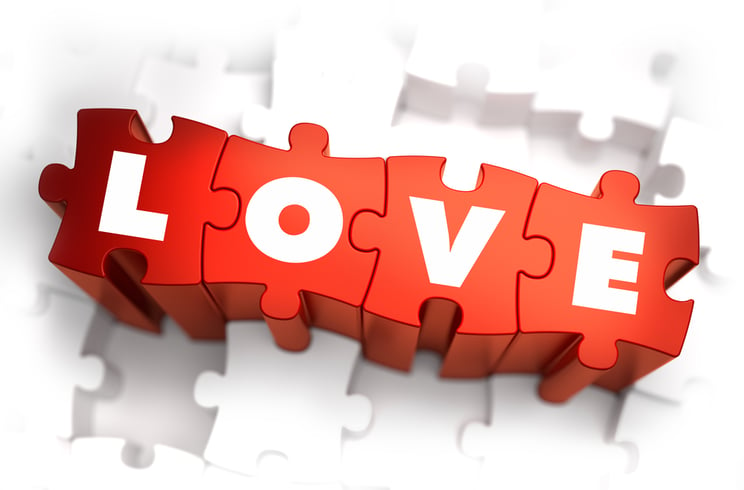 Love - Text on Red Puzzles with White Background and Selective Focus.
