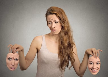 beautiful girl holds two masks